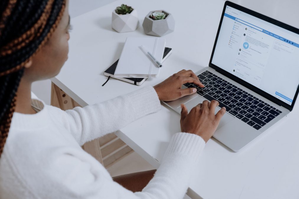 financestream employee setting up a facebook ad on a laptop