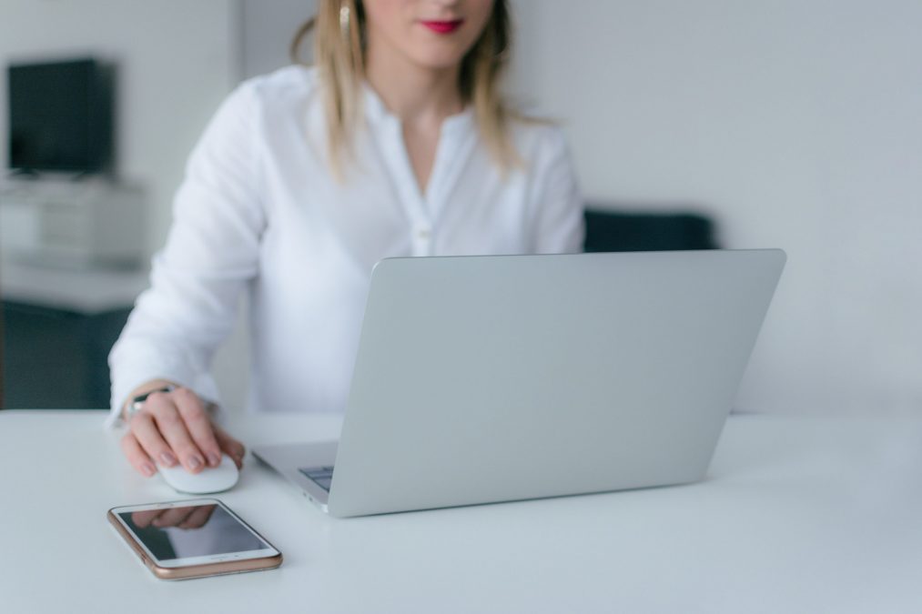 lady at a laptop filling out her details on a landing page