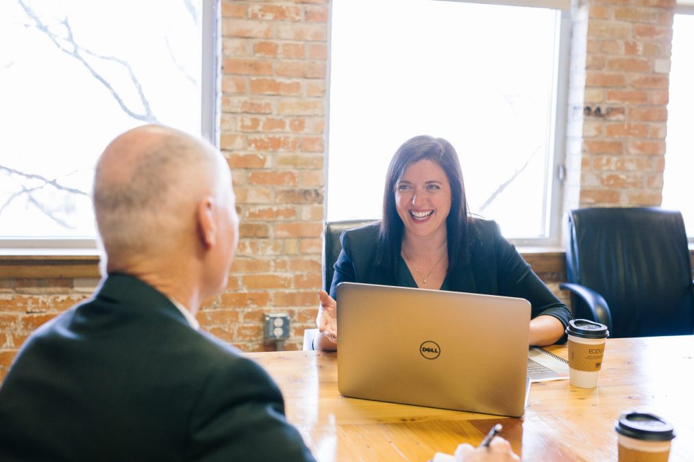 a business man having a conversation with a business lady about giving a review