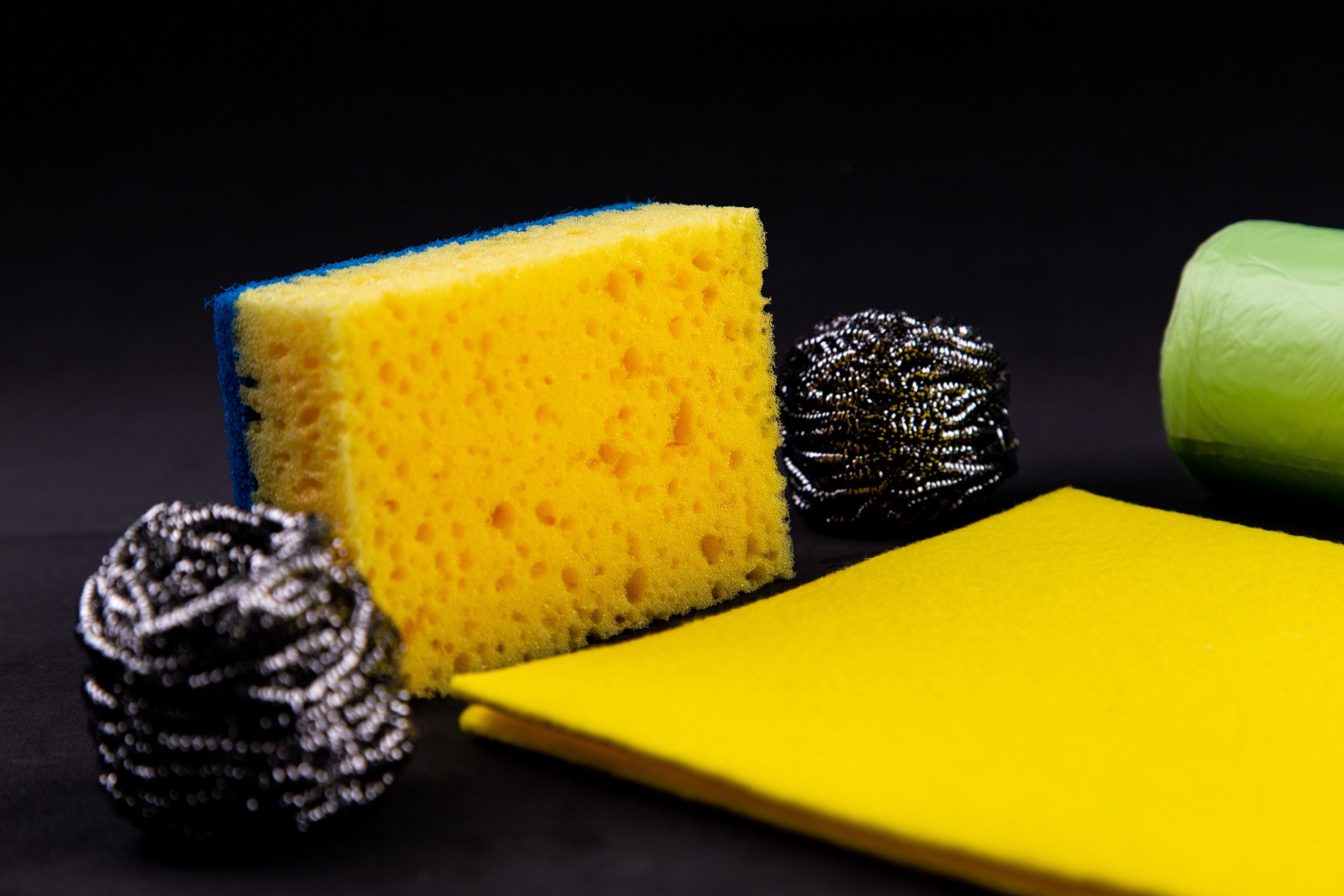sponges, scourer and cloth on a table