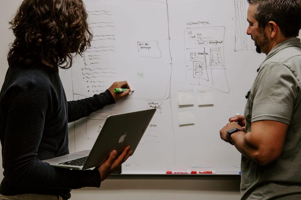 finance stream employees planning on a whiteboard